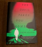 A photo of the book "The Devil Takes You Home"